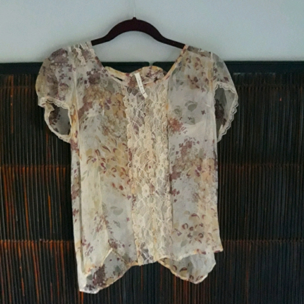 Very pretty sheer open back top